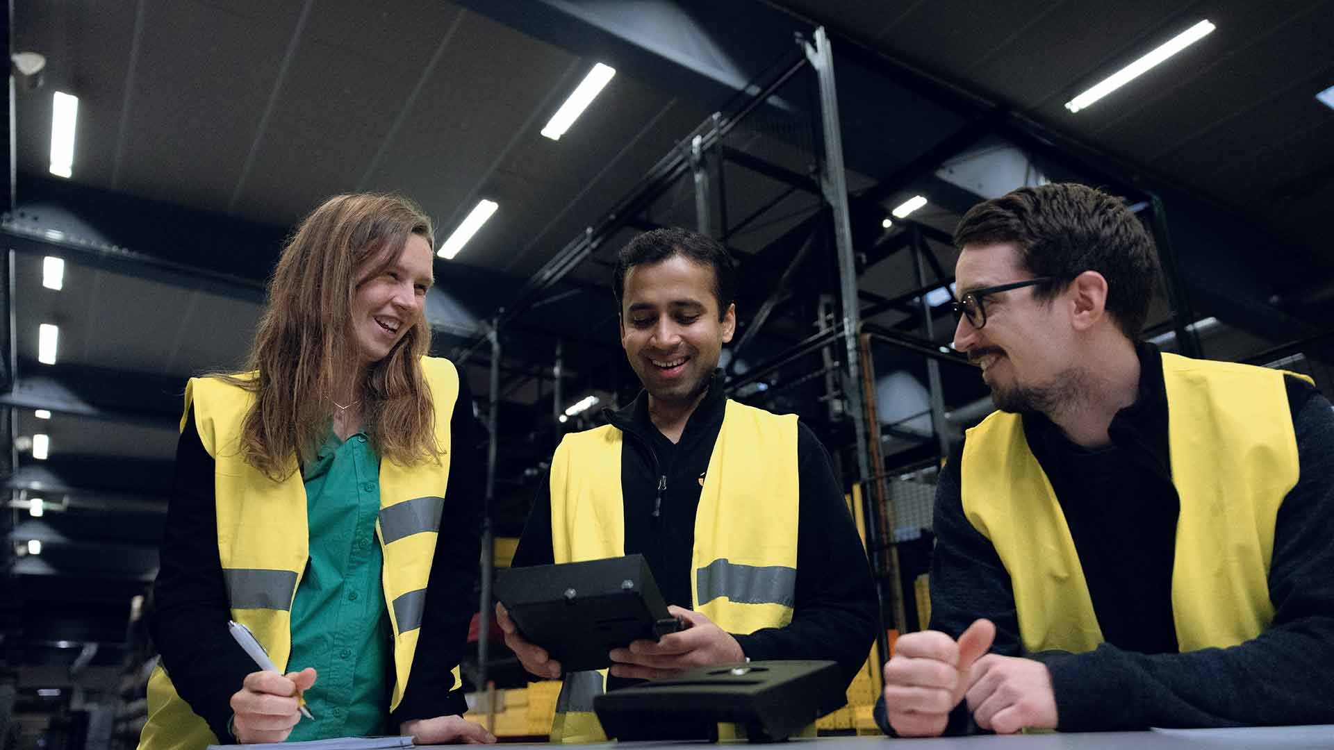 Three people talking about a handle for doors