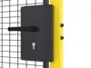 Close up on a black cylinder handle lock mounted on a door with mesh panel