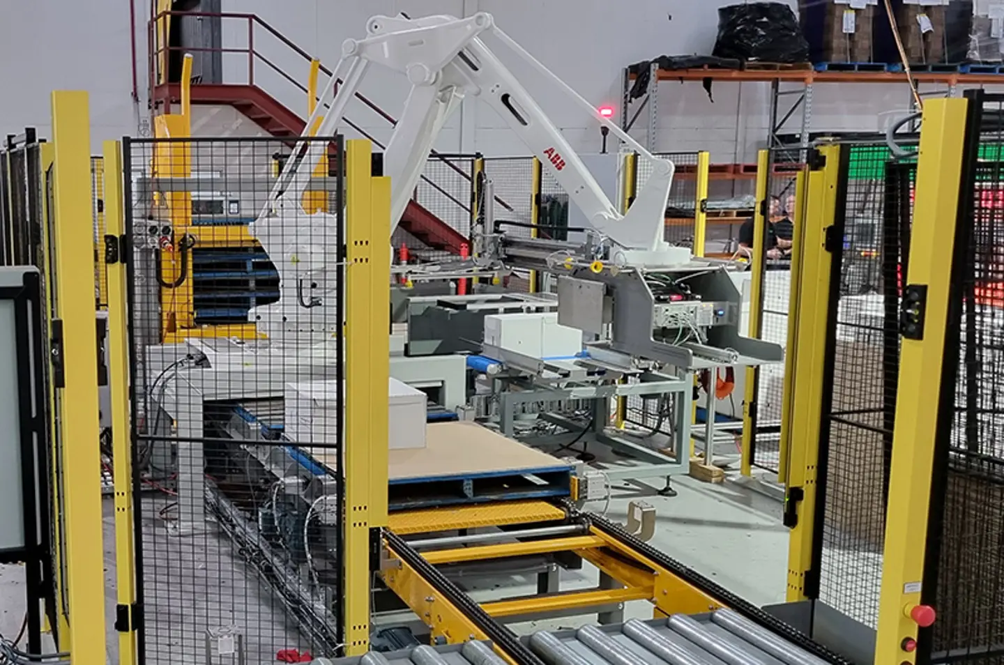 Robotic palletiser stacking large bags with machine guarding for operator safety